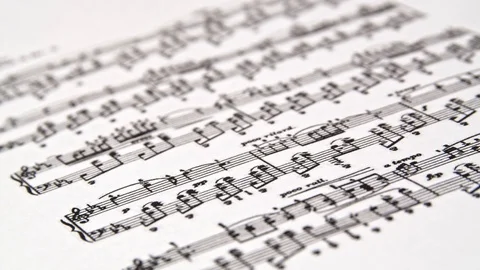 Close macro shot of a music sheet with focus movement. Stock Footage 117424248