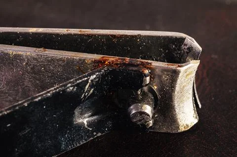Close-up macro shot of old rusty nail clippers with visible dirt and grime Foto stock