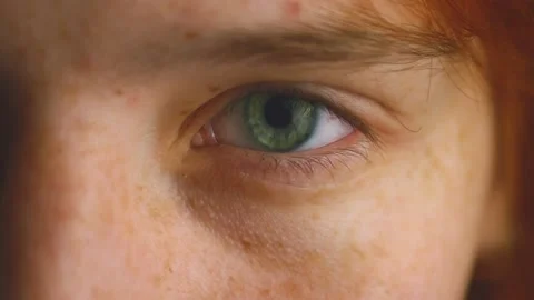 Close Up. Macro Shot Opening and Closing Blue eyes Close Up Human eye iris Stock Footage 223597646