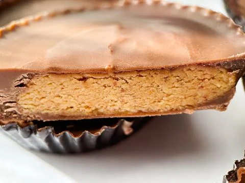 Close up macro shot of Peanut butter filled candy with chocolate frosting Stock Photos