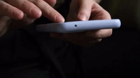 Close-up macro shot of person using smartphone browsing pictures on social .. Stock Footage 272780618