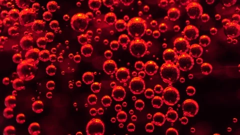 Close up/ Macro shot of red soda water bubble floating up Stock Footage 107806931