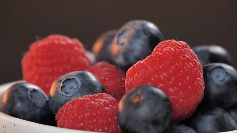 Close up macro shot of ripe fresh berries (raspberries, blueberries) Stock Footage 123991702