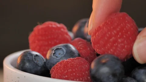 Close up macro shot of ripe fresh berries (raspberries, blueberries) Stock Footage 123991747