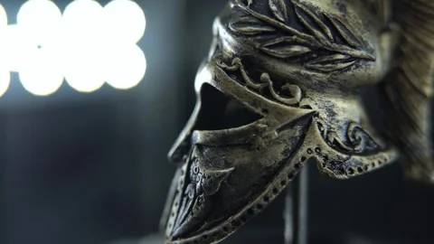 Close macro shot of rotating ancient helmet, bronze texture with moisture and Stock Footage 334136116