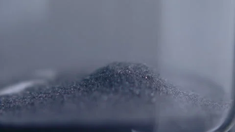 Close up macro shot of sand clock / hourglass sand pouring in slow motion. Stock Footage 273113622
