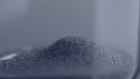 Close up macro shot of sand clock / hourglass sand pouring in slow motion. Stock Footage 273113782