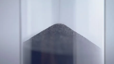 Close up macro shot of sand clock / hourglass sand pouring in slow motion. Stock Footage 273114179