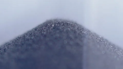 Close up macro shot of sand clock / hourglass sand pouring in slow motion. Stock Footage 273114237