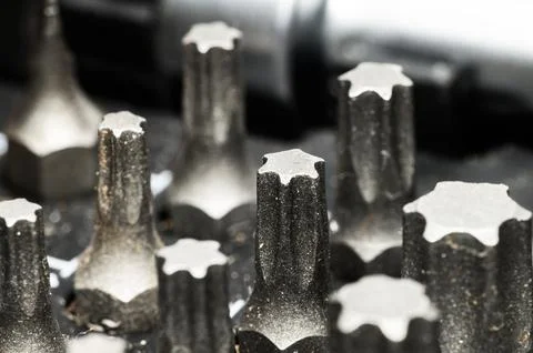 Close-up macro shot of a set of Torx screwdriver bits in a toolbox Photos