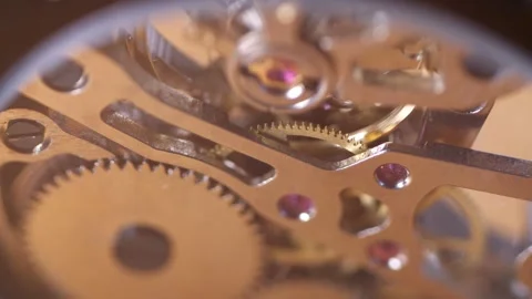 Up close macro shot of a skeleton watch and gears moving inside Stock Footage 282300156