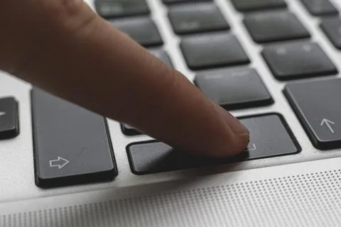 Close up macro shot of the tinker press the button on computer keyboards Stock Photos