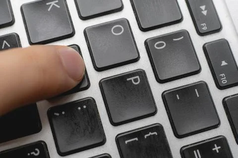 Close up macro shot of the tinker press the button on computer keyboards Stock Photos