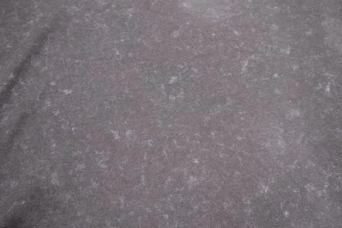 Close-up macro shot of washed grey fabric texture with soft folds and acid-.. 库存照片