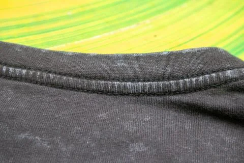 Close-up macro shot of washed grey fabric texture with soft folds and acid-.. Stock Photos