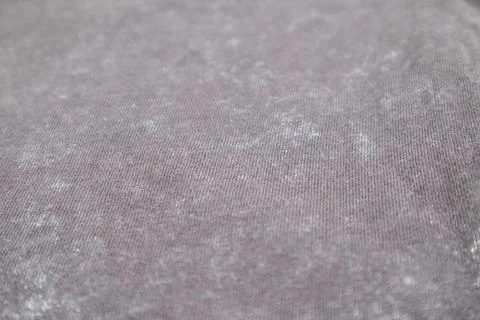 Close-up macro shot of washed grey fabric texture with soft folds and acid-.. Stock Photos