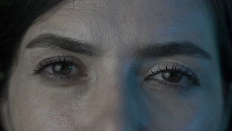 Close up, macro shot of woman's eye. Young beautiful lady's brown eyes. Stock Footage 134550296