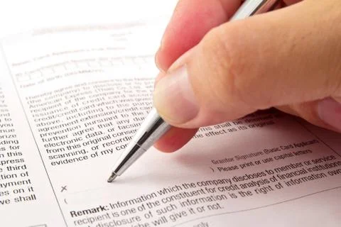 Close-up macro of signing a contract. Stock Photos