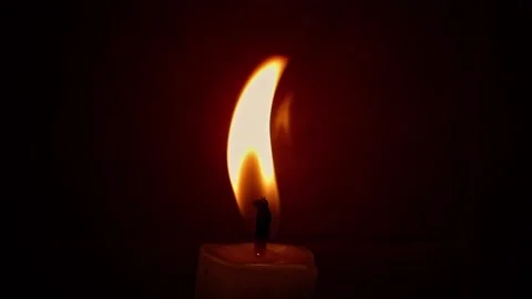 Close-up Macro With Single Candle Flame Isolated on Black Background In Slow Video stock 139795370