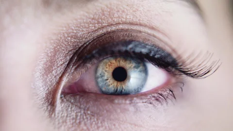 Close up macro slow motion shot of beautiful green eye opening Stock Footage 273416308