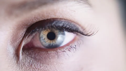 Close up macro slow motion shot of beautiful green eye opening Stock Footage 273416321