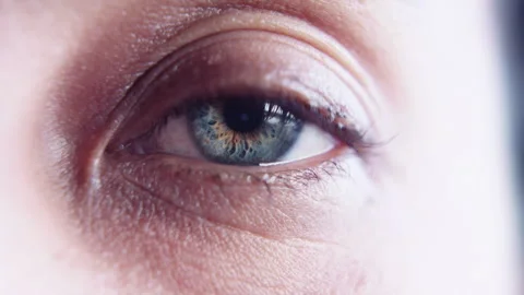 Close up macro slow motion shot of beautiful green eye opening Stock Footage 273416536