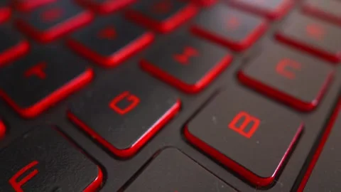 Close up macro slow pan of a gaming laptop keyboard Stock Footage 339474566