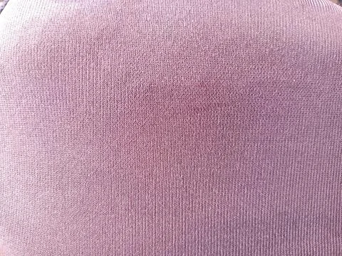Close up macro of soft pink knitted fabric texture, ribbed weave background.. Foto stock