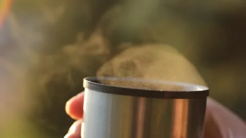 Close up macro steam is going up from the tea cup with sunlight background 스톡 동영상 202300629