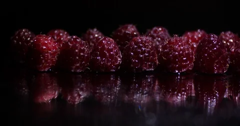 Close up macro studio dolly shot movement along a row of fresh raspberries Stock-Footage 114959874