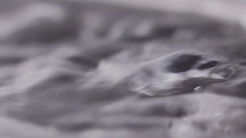 Close up macro of surface boiling water Video stock 274229283