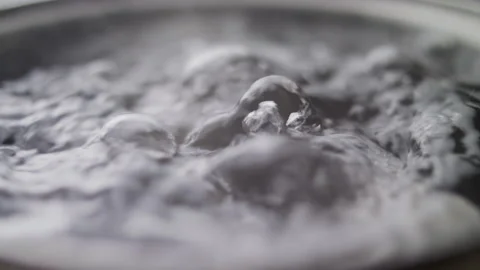 Close up macro of surface boiling water Stock Footage 274233912