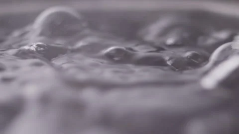 Close up macro of surface boiling water Stock Footage 274235338
