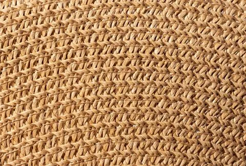 Close-up macro texture of a braided straw hat, abstract background Foto stock