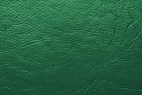 Close up, macro texture of green glossy natural genuine leather, leatherett.. Stock Photos