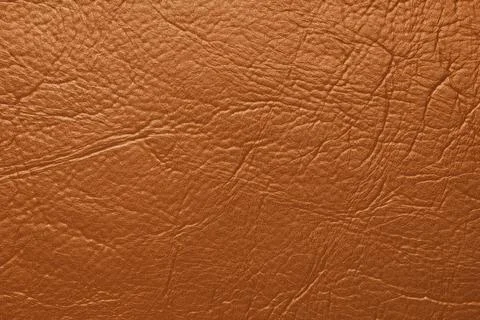 Close up, macro texture of orange glossy natural genuine leather, leatheret.. Stock Photos