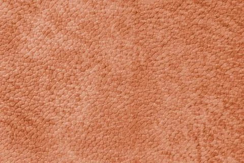 Close up, macro texture of orange suede, faux leather surface with natural .. Foto stock