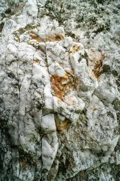 Close up macro texture of white granite rock with mineral inclusions Fotos de archivo