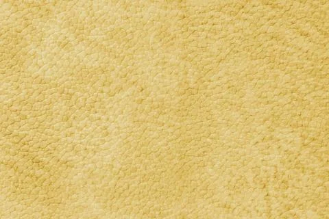 Close up, macro texture of yellow suede, faux leather surface with natural .. Stock Photos
