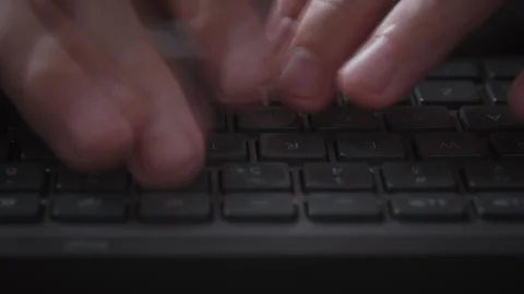 Close-up macro time-lapse male hands typing rapidly on keyboard with motion blur Stock Footage 340926582