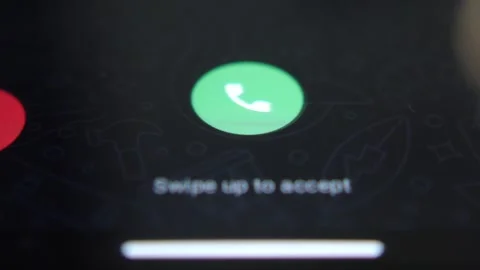 Close-up macro video of animation an incoming call interface on a mobile phone Stock Footage 312413431