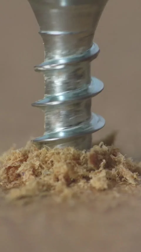 Close up macro video of drilling the small screw into wood Stock Footage 305583308