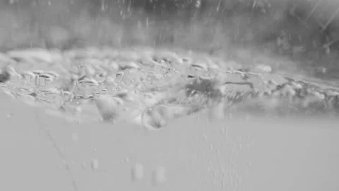 Close-up, macro view of boiled water, in slow motion Stock Footage 131101548