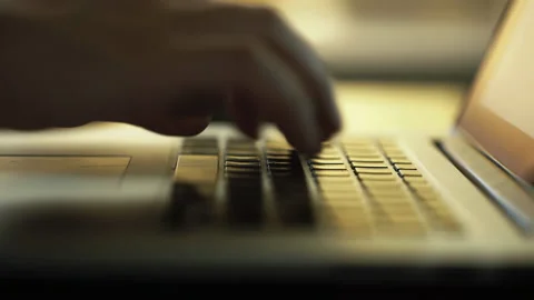 Close-up macro view of businessman or student typing on laptop computer keyboard Vidéo 168596170