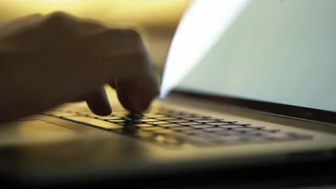 Close-up macro view of businessman or student typing on laptop computer keyboard Vidéo 168654153