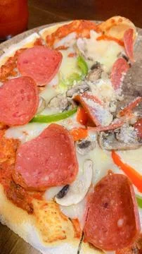 Close up macro view of a delicious hot cheese pizza slice Stock Photos