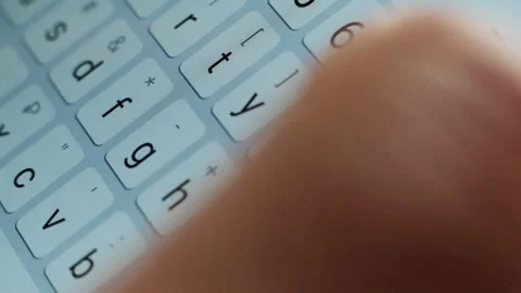 Close Up Macro View of Finger Typing Text on Smartphone Keypad or Keyboard Stock Footage 195093630