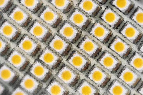 Close-up macro view of led smd bulb lamp with rows of yellow diode light Stock Photos