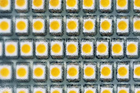 Close-up macro view of led smd bulb lamp with rows of yellow diode light Stock Photos