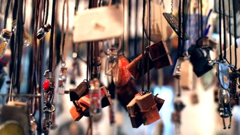 Close-up macro view of lots handmade sweet pendants hanging up in stylish ethnic 스톡 동영상 116267941